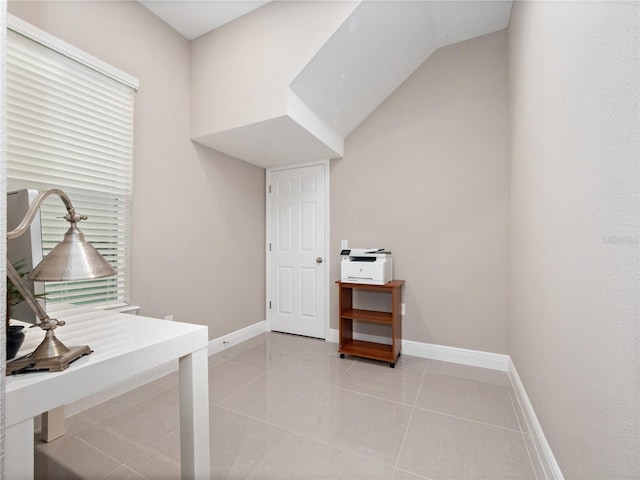 washroom with light tile patterned flooring and baseboards