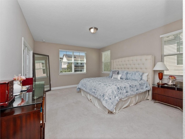 carpeted bedroom with baseboards