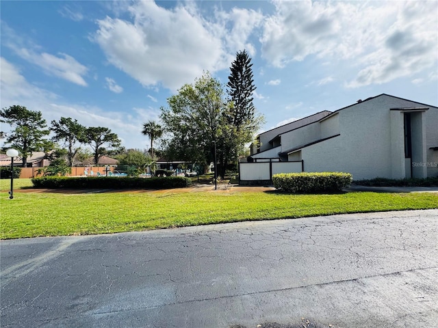 view of property's community with a yard