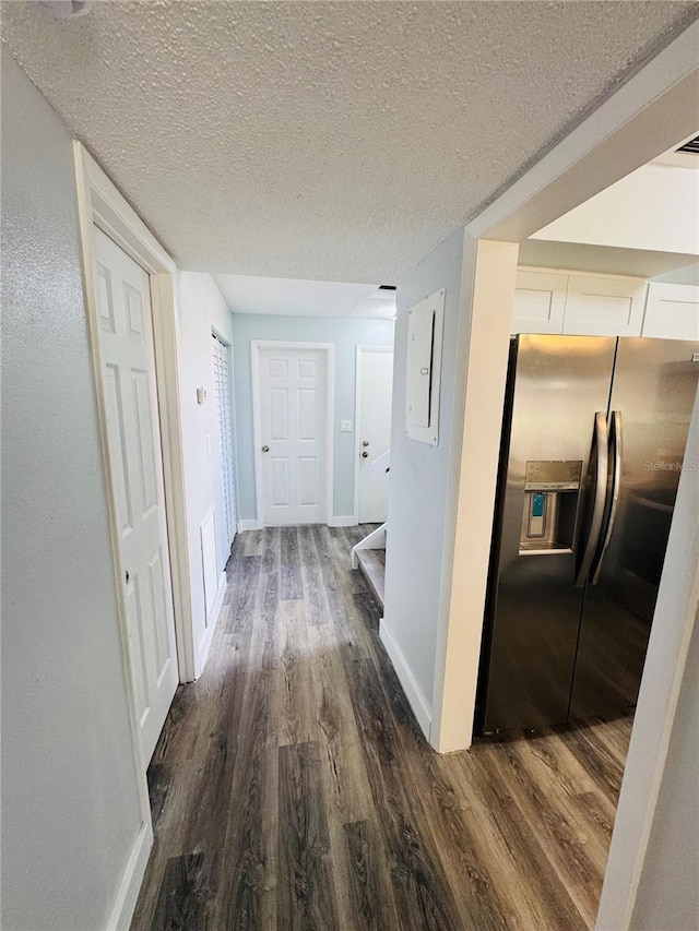 4100 Player Cir Unit 101, Orlando, FL 32808 - hallway with electric panel, baseboards, dark wood-type flooring, and a textured ceiling