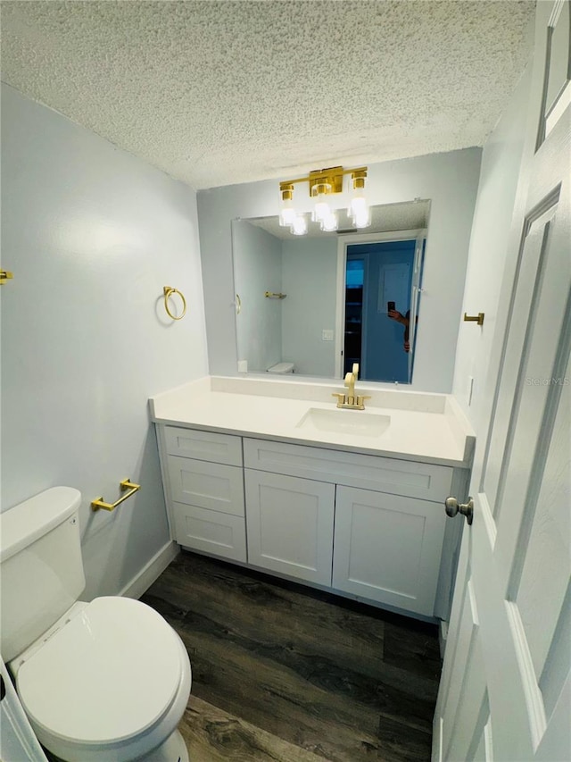 4100 Player Cir Unit 101, Orlando, FL 32808 - bathroom with vanity, toilet, and a textured ceiling