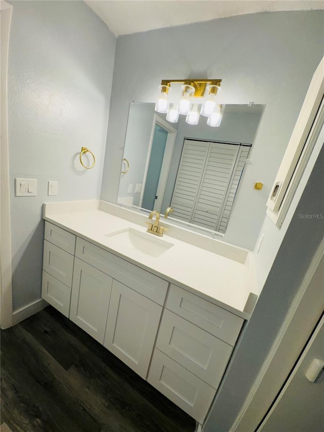4100 Player Cir Unit 101, Orlando, FL 32808 - bathroom with vanity, wood finished floors, and baseboards