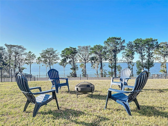3279 Landing Vw, Tavares, FL 32778 - view of yard featuring a water view, an outdoor fire pit, and fence