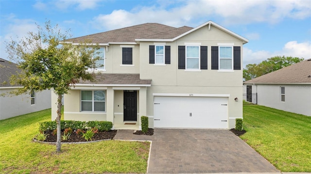 3279 Landing Vw, Tavares, FL 32778 - traditional-style house with a front yard, a garage, stucco siding, decorative driveway, and roof with shingles