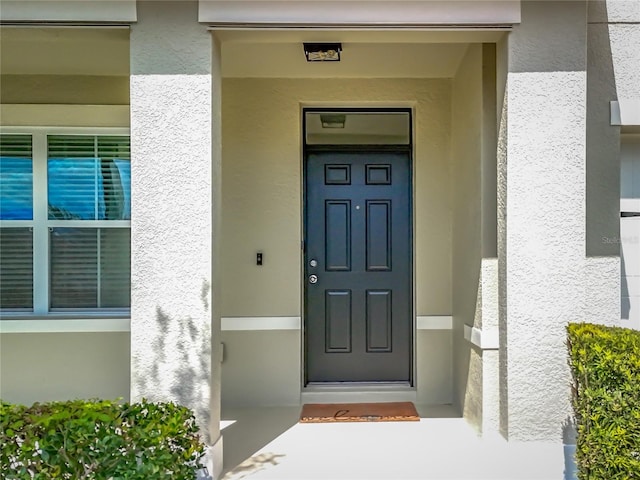 3279 Landing Vw, Tavares, FL 32778 - entrance to property featuring stucco siding