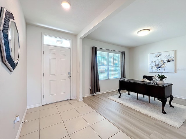 3279 Landing Vw, Tavares, FL 32778 - foyer with light tile patterned floors and baseboards