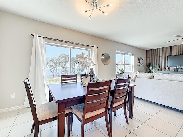 3279 Landing Vw, Tavares, FL 32778 - dining room with a notable chandelier, a textured ceiling, and light tile patterned flooring