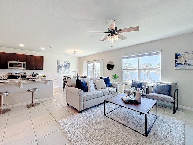 3279 Landing Vw, Tavares, FL 32778 - living room with baseboards, recessed lighting, light tile patterned floors, a ceiling fan, and visible vents