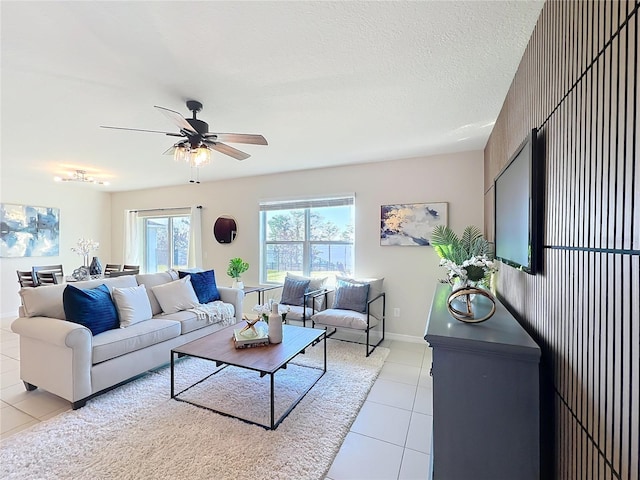 3279 Landing Vw, Tavares, FL 32778 - living area with light tile patterned flooring, baseboards, and a ceiling fan
