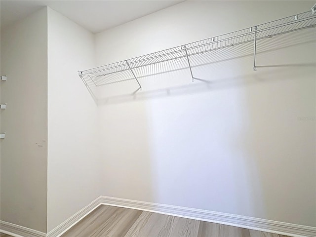 3279 Landing Vw, Tavares, FL 32778 - spacious closet with wood finished floors