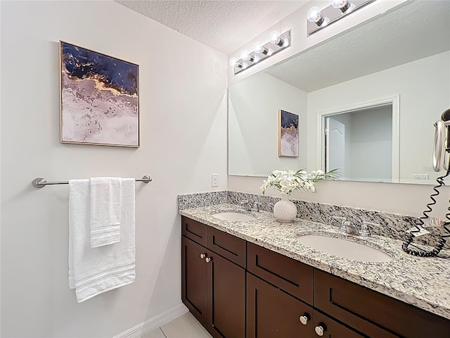 3279 Landing Vw, Tavares, FL 32778 - full bathroom featuring a sink, double vanity, and a textured ceiling
