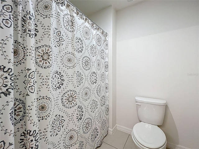 3279 Landing Vw, Tavares, FL 32778 - bathroom featuring a shower with shower curtain, tile patterned floors, baseboards, and toilet