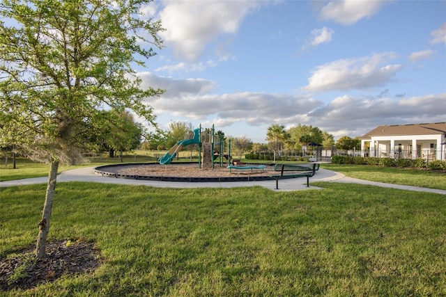 community playground featuring a lawn