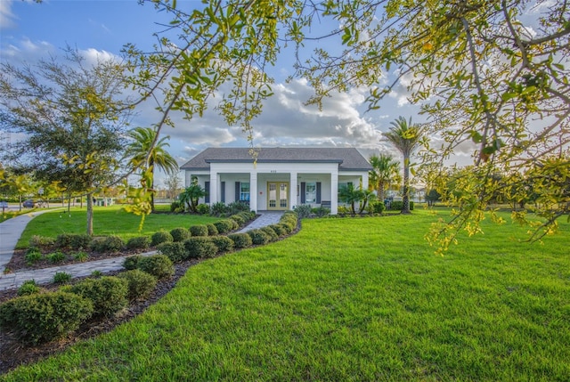 view of front of property with french doors and a front yard