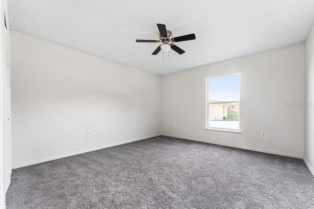 empty room featuring baseboards, carpet, and ceiling fan