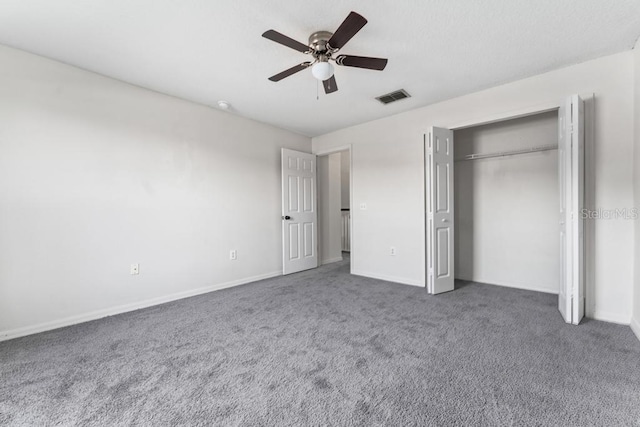 unfurnished bedroom with visible vents, baseboards, carpet floors, a closet, and a ceiling fan