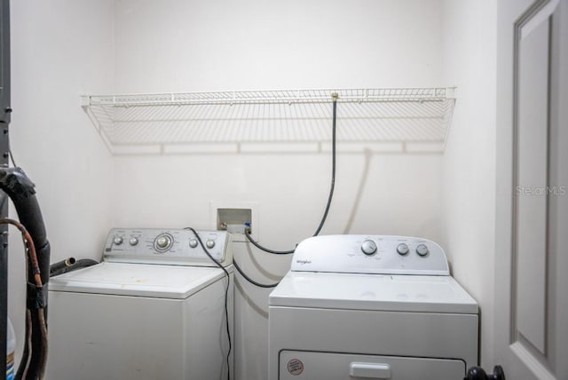 laundry room featuring laundry area and separate washer and dryer