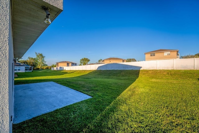 view of yard with a patio area and fence