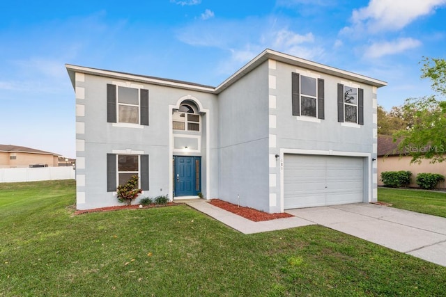 traditional-style home featuring stucco siding, a front lawn, an attached garage, and driveway