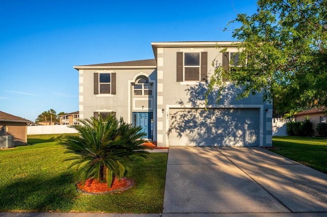 view of front of property with stucco siding, a front lawn, a garage, and driveway