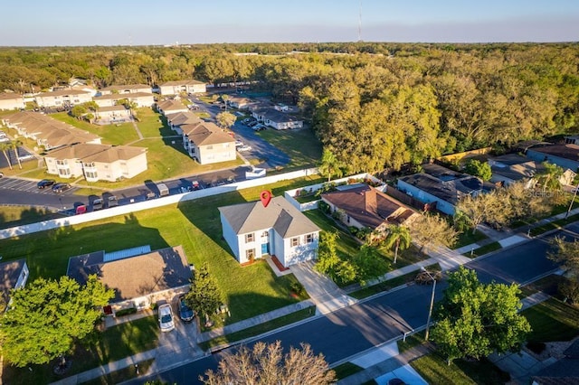 bird's eye view featuring a residential view and a forest view