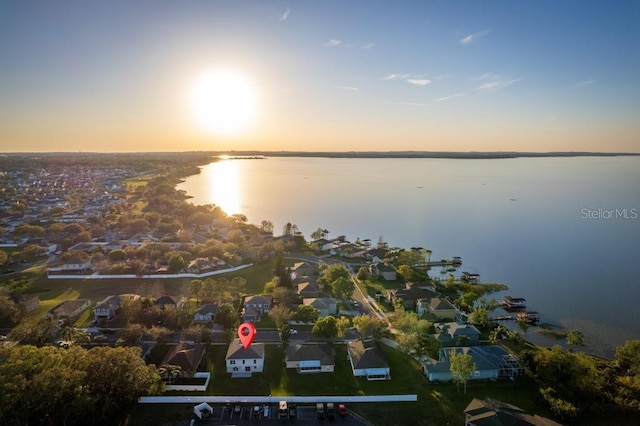 bird's eye view featuring a water view and a residential view