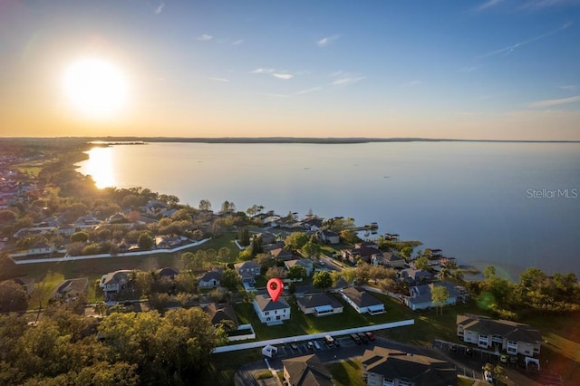 bird's eye view with a water view and a residential view