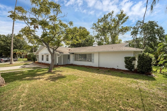 view of front of home with a front lawn