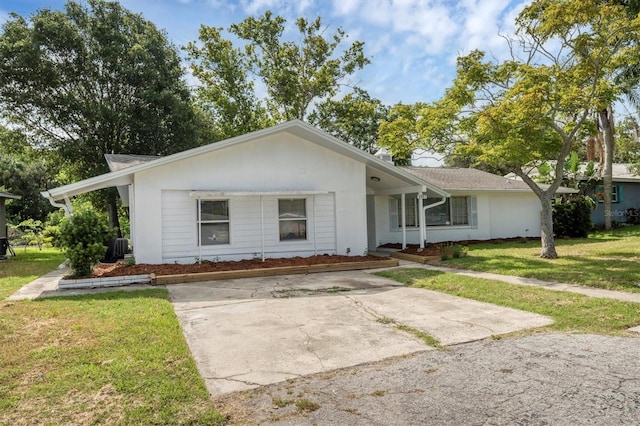 single story home featuring a front lawn