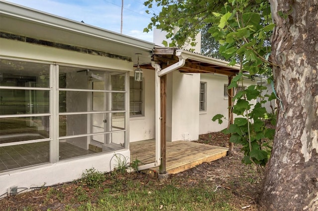 view of side of home with stucco siding