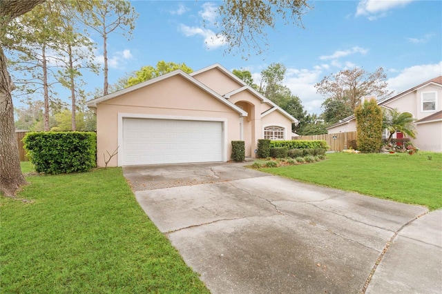 view of front of house featuring fence, driveway, stucco siding, a front lawn, and a garage