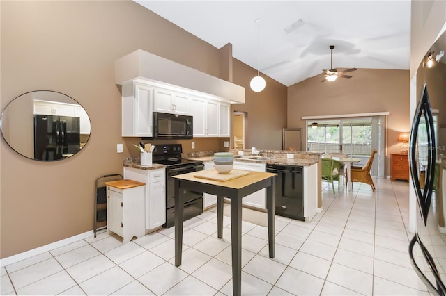 kitchen featuring black appliances, a sink, a peninsula, white cabinets, and ceiling fan