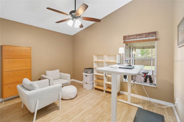 office space featuring baseboards, a ceiling fan, lofted ceiling, and wood finished floors