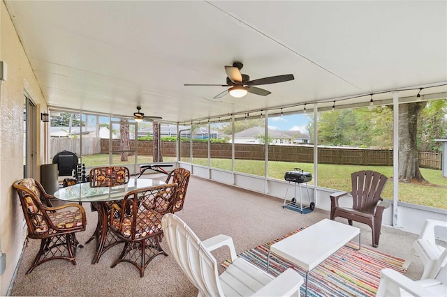 sunroom with a ceiling fan