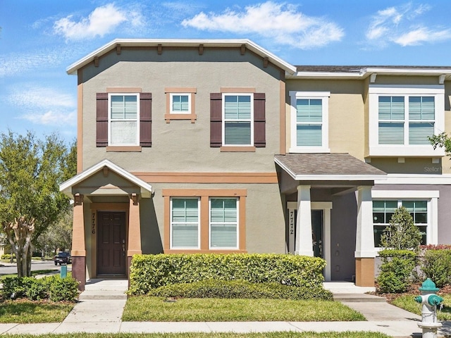 townhome / multi-family property featuring stucco siding