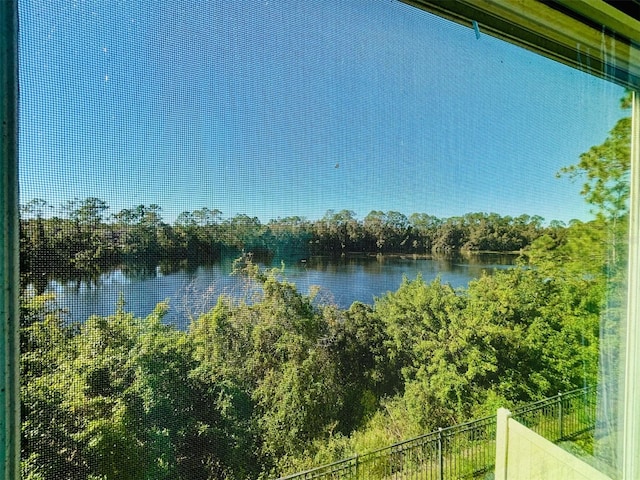 property view of water featuring fence