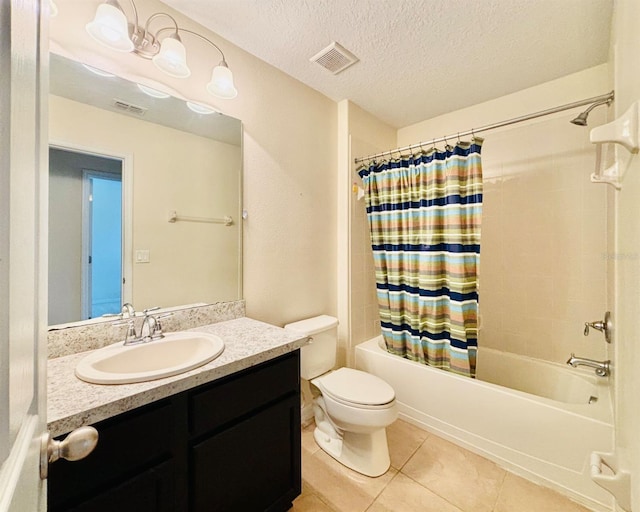 full bath featuring tile patterned floors, visible vents, shower / bath combo, a textured ceiling, and vanity