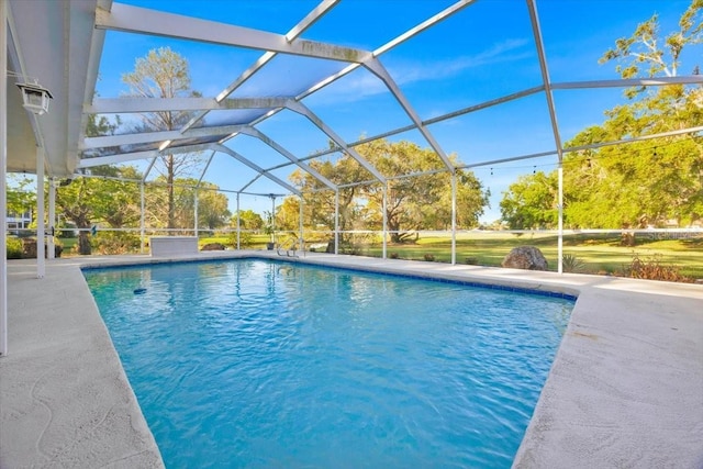 pool featuring a lanai and a patio area