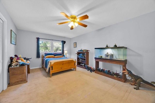 carpeted bedroom featuring a ceiling fan