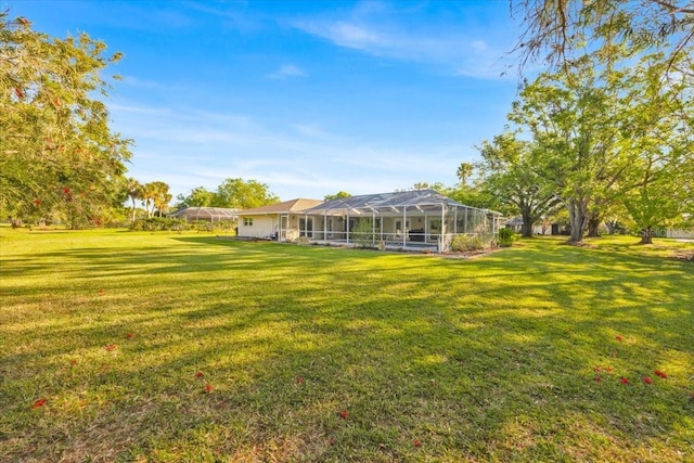 view of yard featuring a lanai