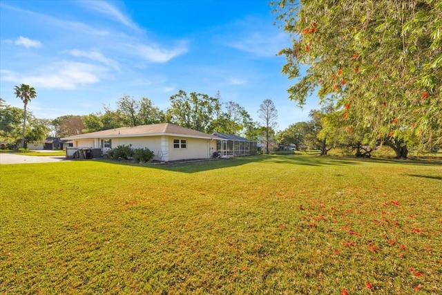 view of yard featuring a lanai