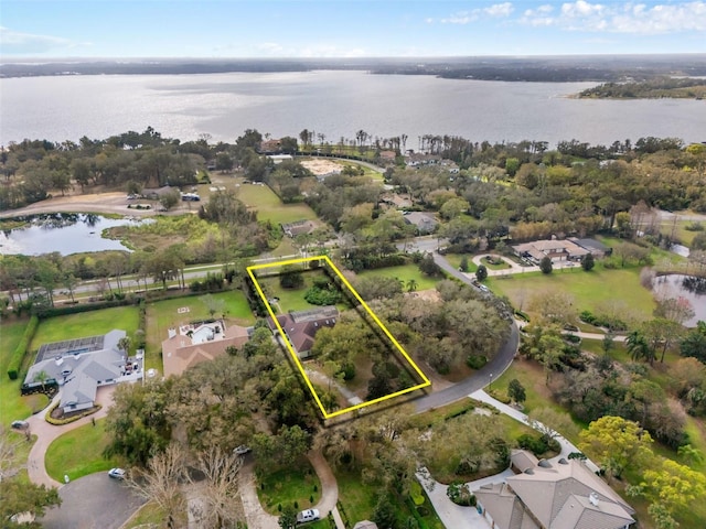 birds eye view of property featuring a water view