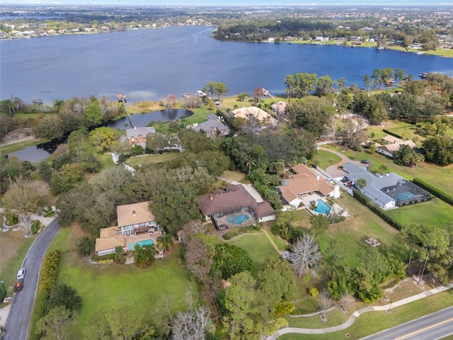 birds eye view of property with a water view