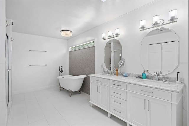 bathroom featuring double vanity, a soaking tub, baseboards, and a sink