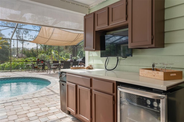 kitchen with brick floor, a sunroom, light countertops, wine cooler, and backsplash