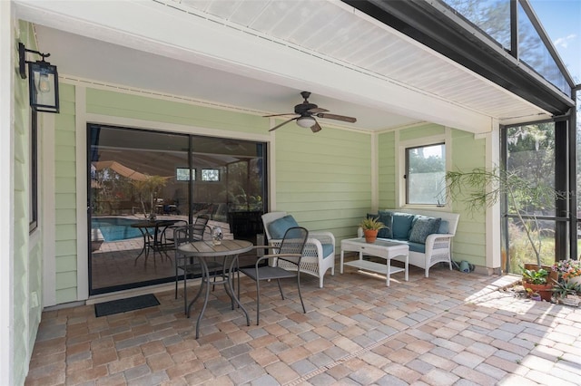 view of patio featuring ceiling fan, a lanai, and an outdoor hangout area