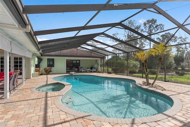 view of swimming pool with a patio, a diving board, a pool with connected hot tub, and a lanai