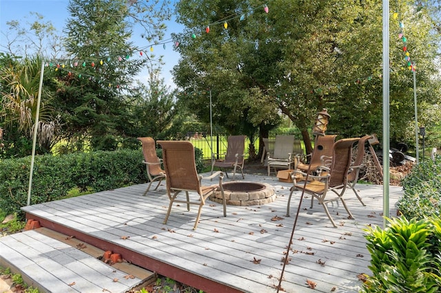 deck featuring an outdoor fire pit