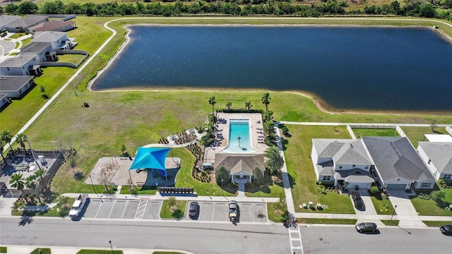 birds eye view of property with a water view