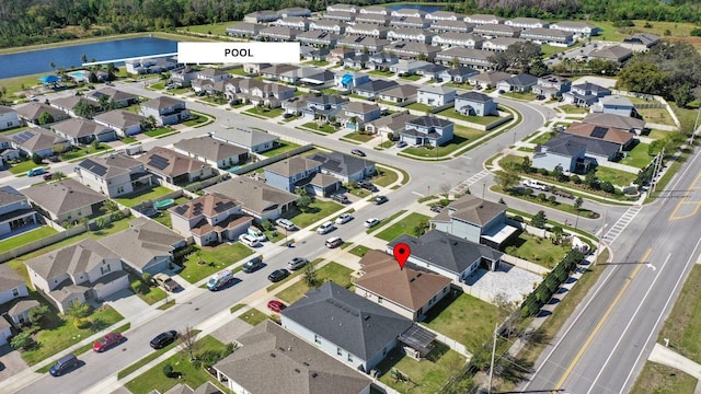 aerial view featuring a residential view and a water view